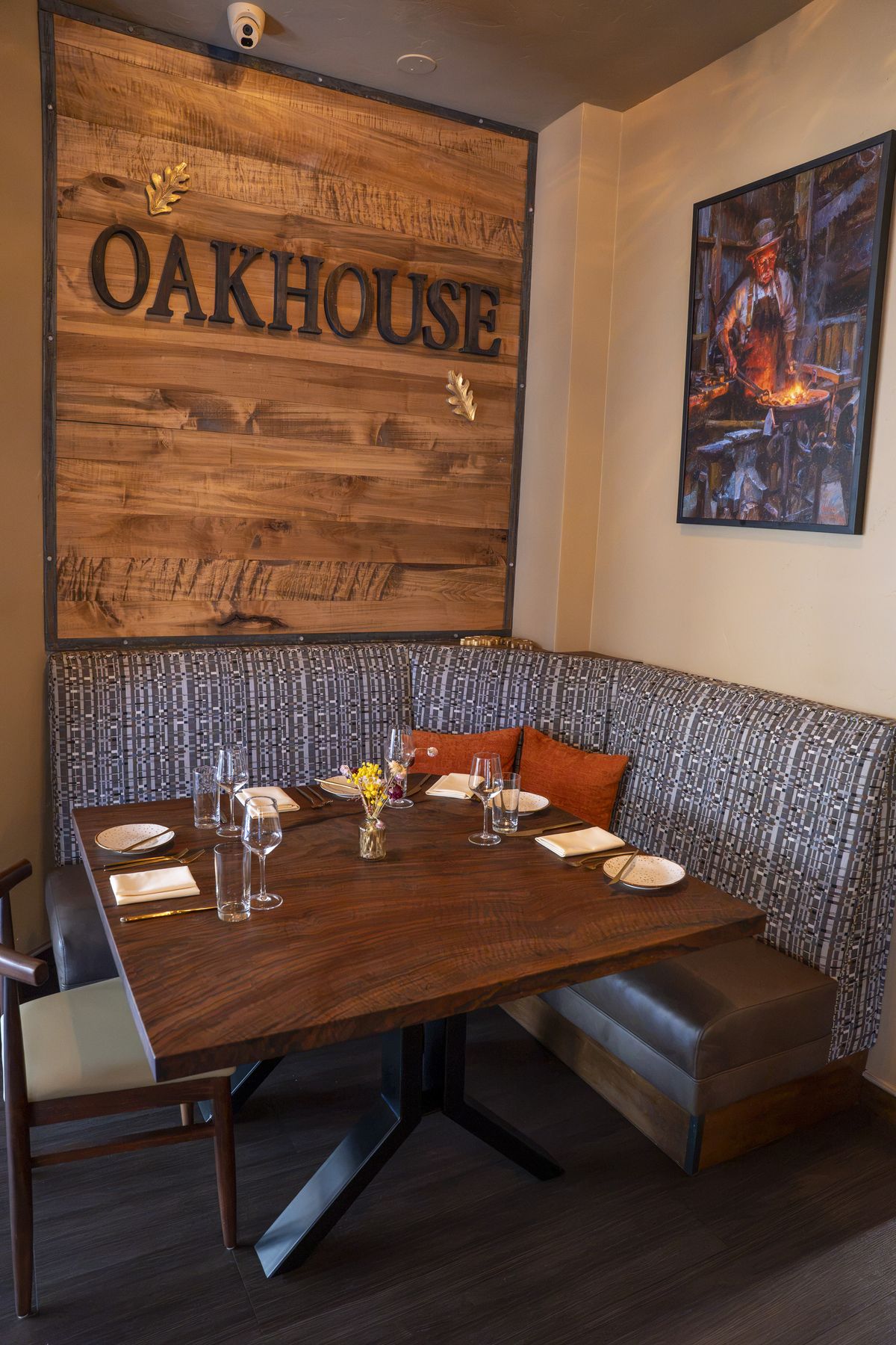A booth under the Oakhouse sign